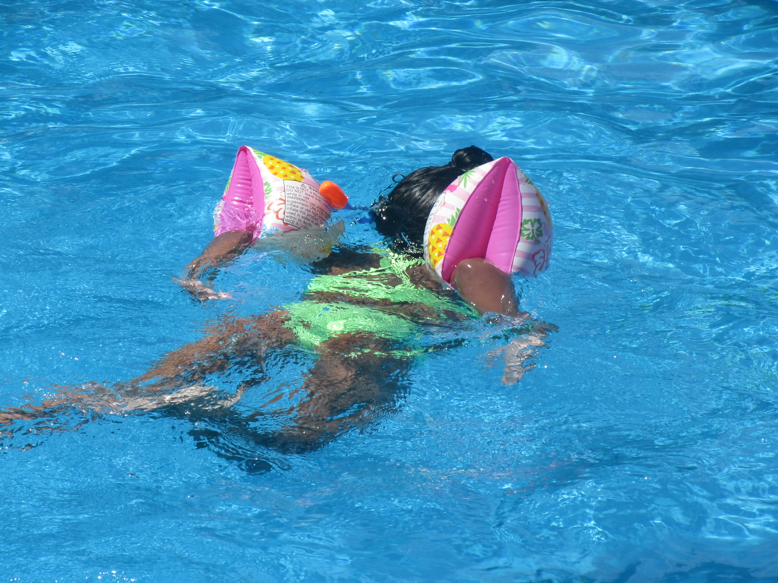 Child swimming at Bunert Pool